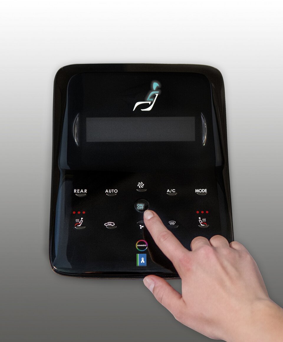 Demonstrator for the control panel of a centre console, produced using DirectCoating by back moulding a printed Makrofol polycarbonate film and surface finishing with deep gloss based on puroclear. (Source: R&uuml;hl Puromer)